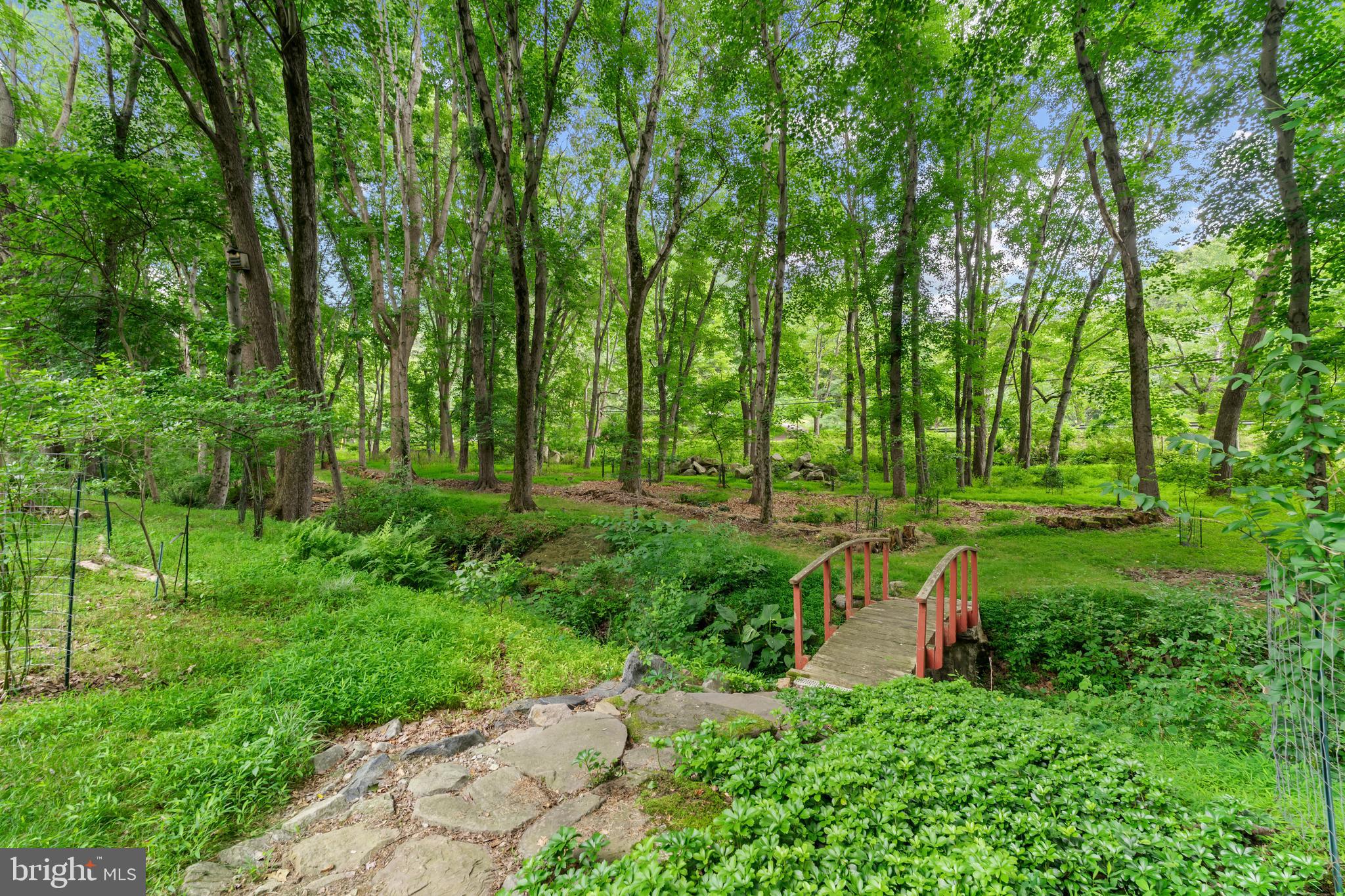 10821 Braeburn Road Columbia, MD 21044 - Photo 63 of 64 a backyard of a house with a yard and outdoor seating