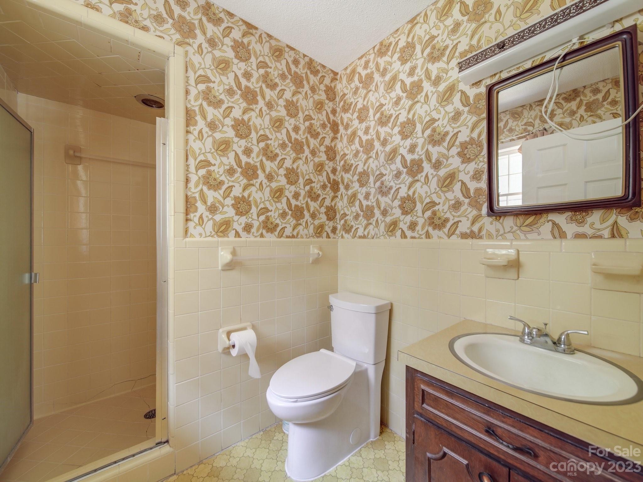 2845 Puetts Chapel Road Bessemer City, NC 28016 - Photo 11 of 15 a bathroom with a toilet sink and mirror