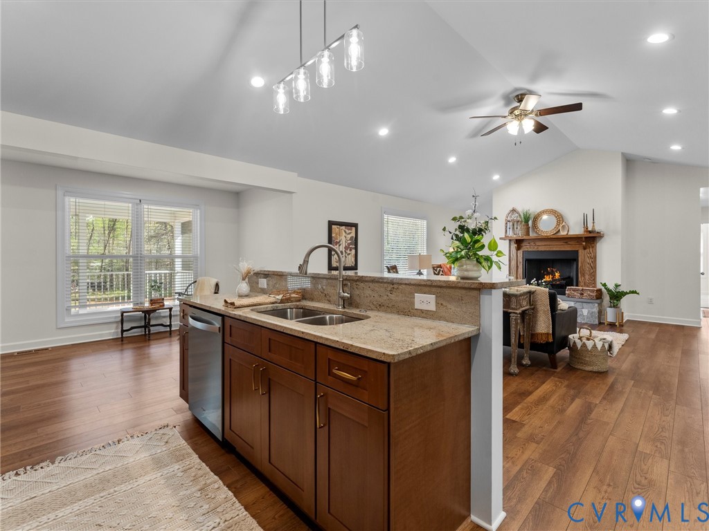 143 High School Road Buckingham, VA 23921 - Photo 12 of 50 a kitchen with a stove a refrigerator and a dining table with wooden floor