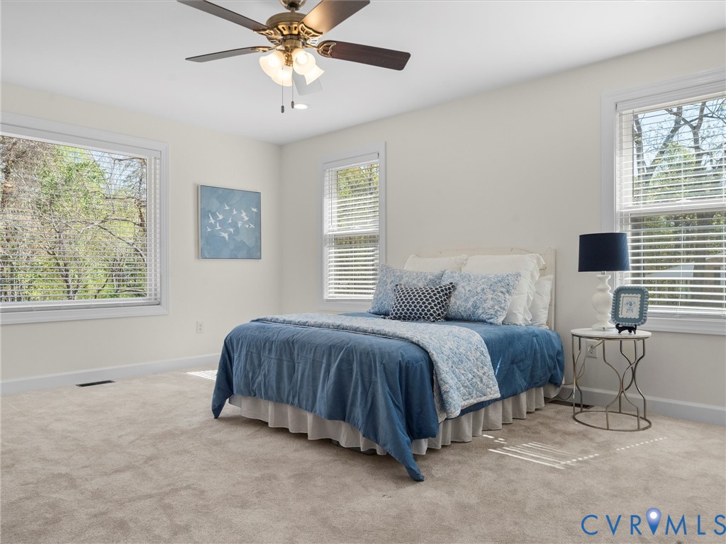 143 High School Road Buckingham, VA 23921 - Photo 23 of 50 a spacious bedroom with a bed and a window