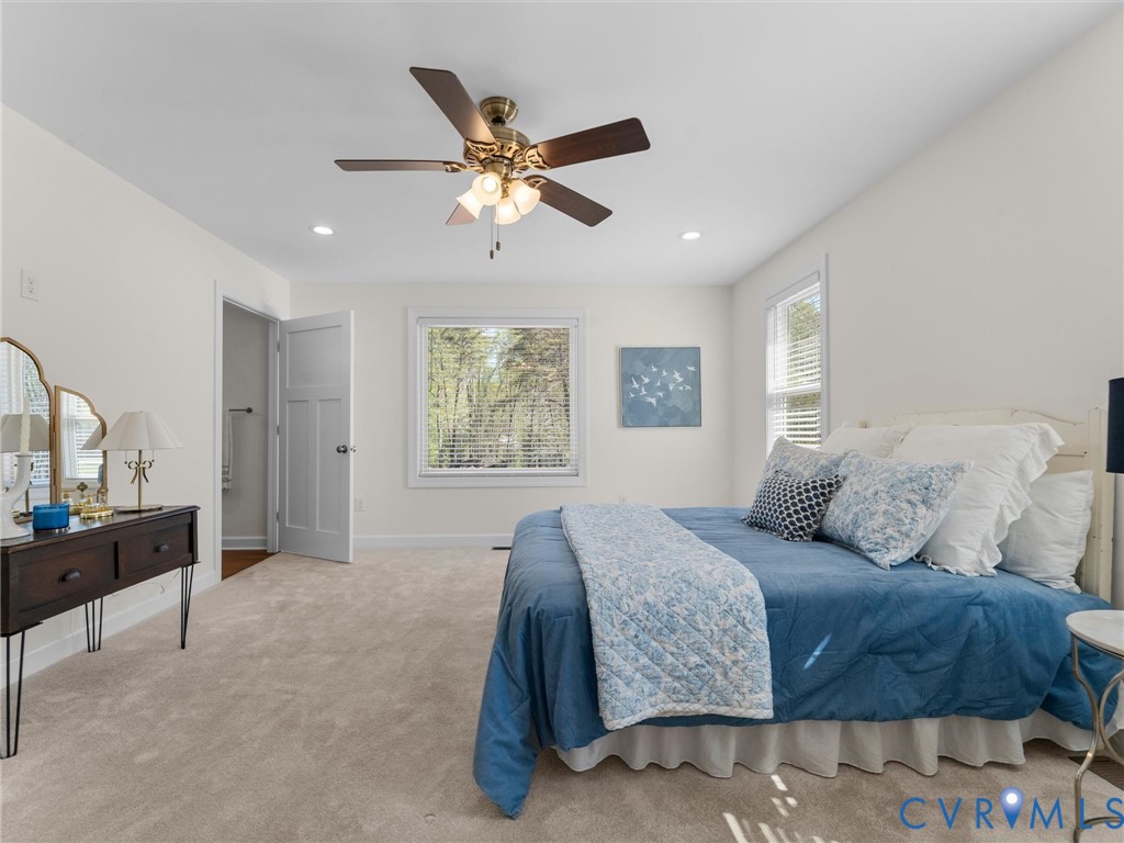 143 High School Road Buckingham, VA 23921 - Photo 24 of 50 a bedroom with a bed and a chandelier