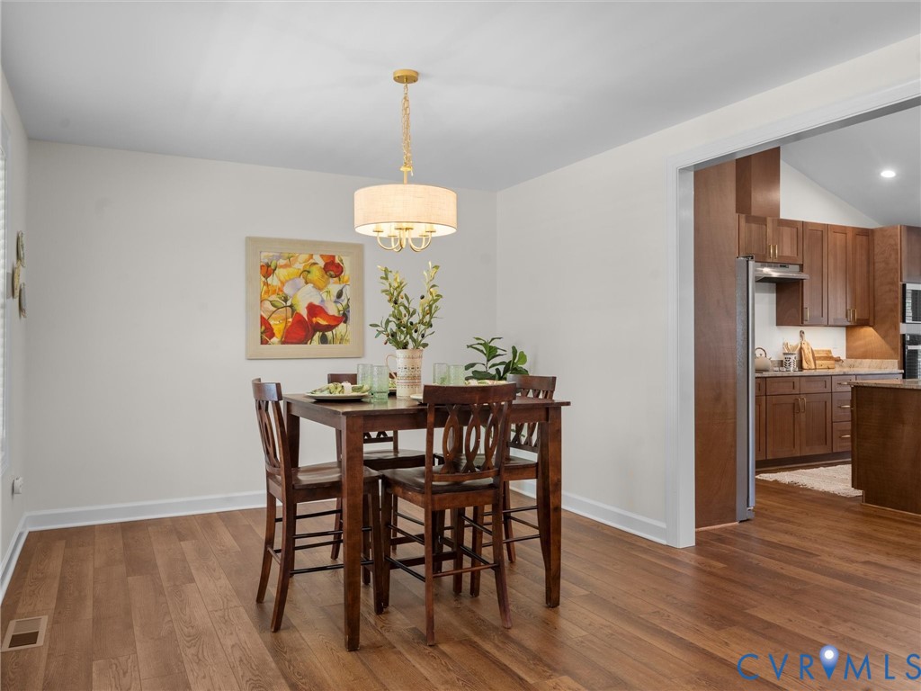 143 High School Road Buckingham, VA 23921 - Photo 10 of 50 a view of a dining room with furniture wooden floor and chandelier