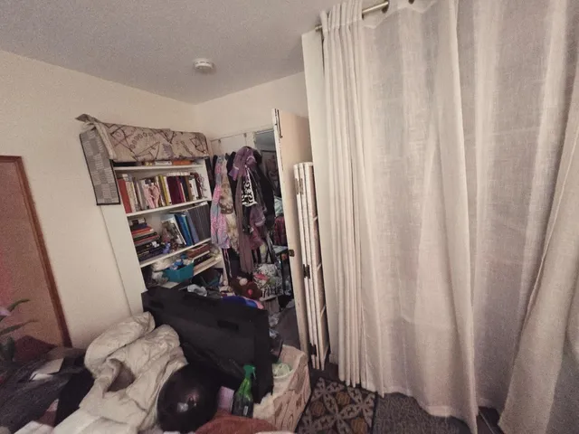 a view of a livingroom with furniture and staircase