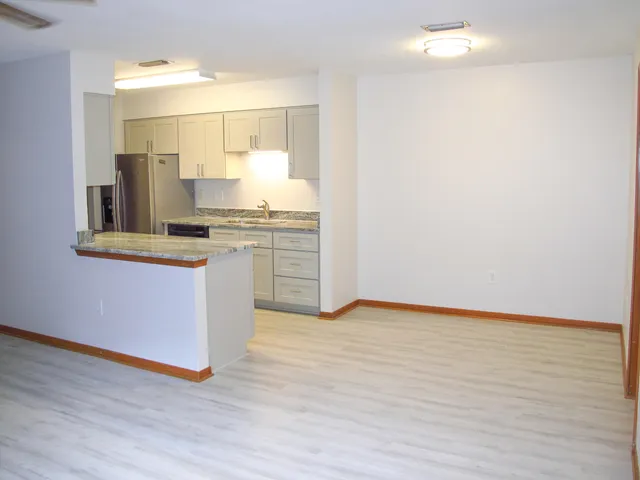 a view of kitchen with wooden floor