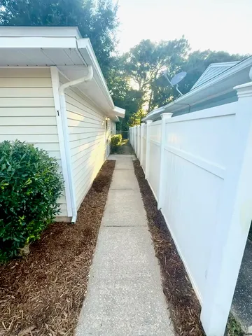 a view of a pathway with a house