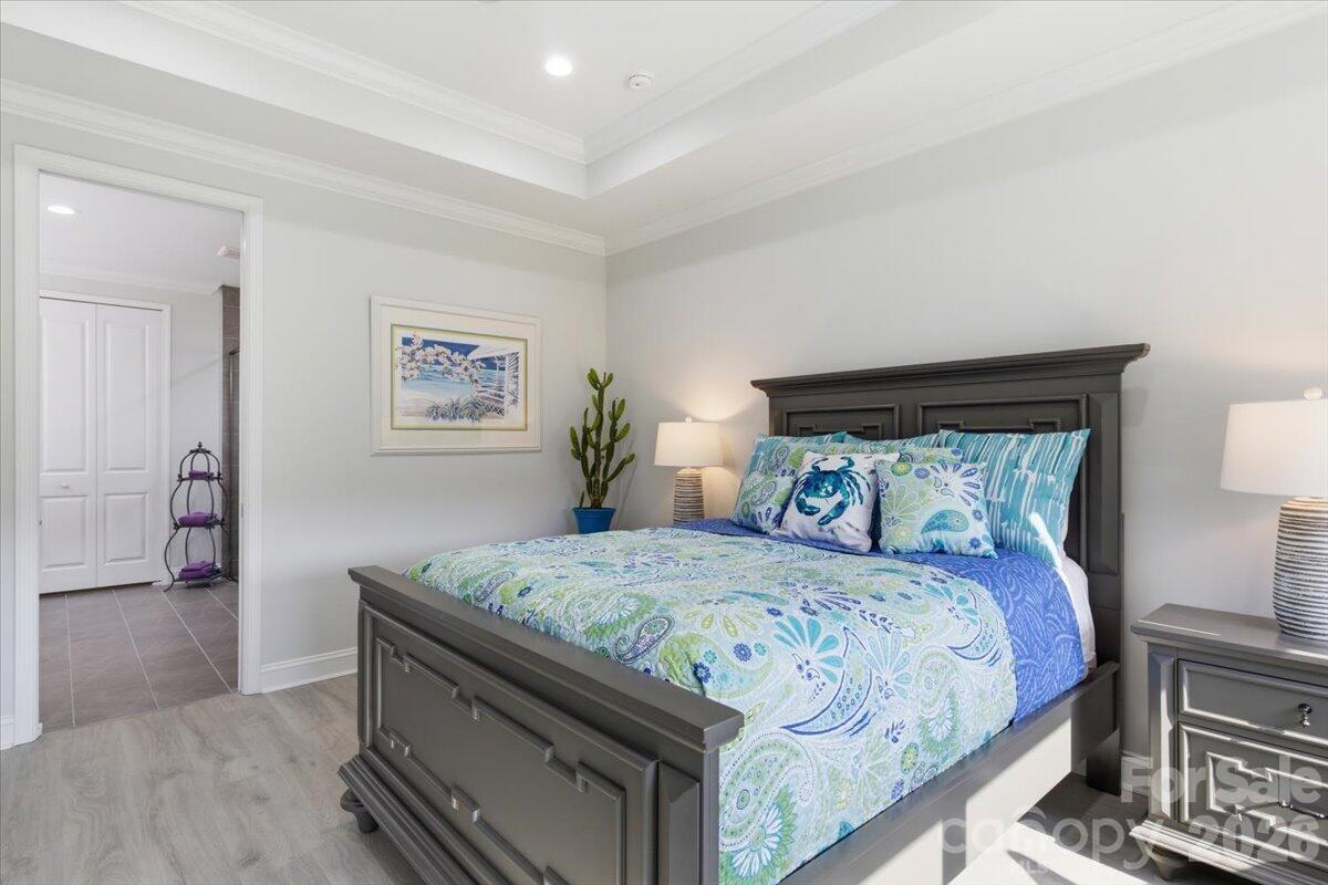 859 Ocean Hammock Loop Hardeeville, SC 29927 - Photo 14 of 33 a bedroom with a bed and a dresser