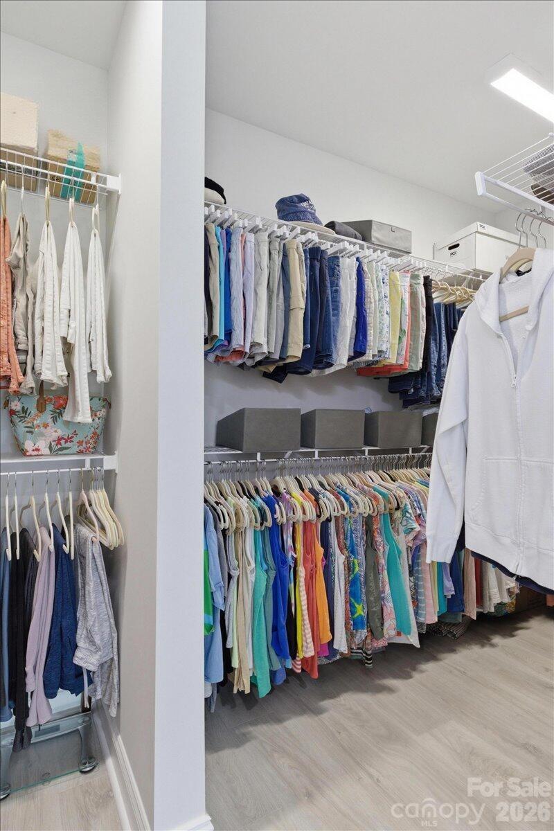 859 Ocean Hammock Loop Hardeeville, SC 29927 - Photo 18 of 33 a view of walk in closet with clothes and shoes