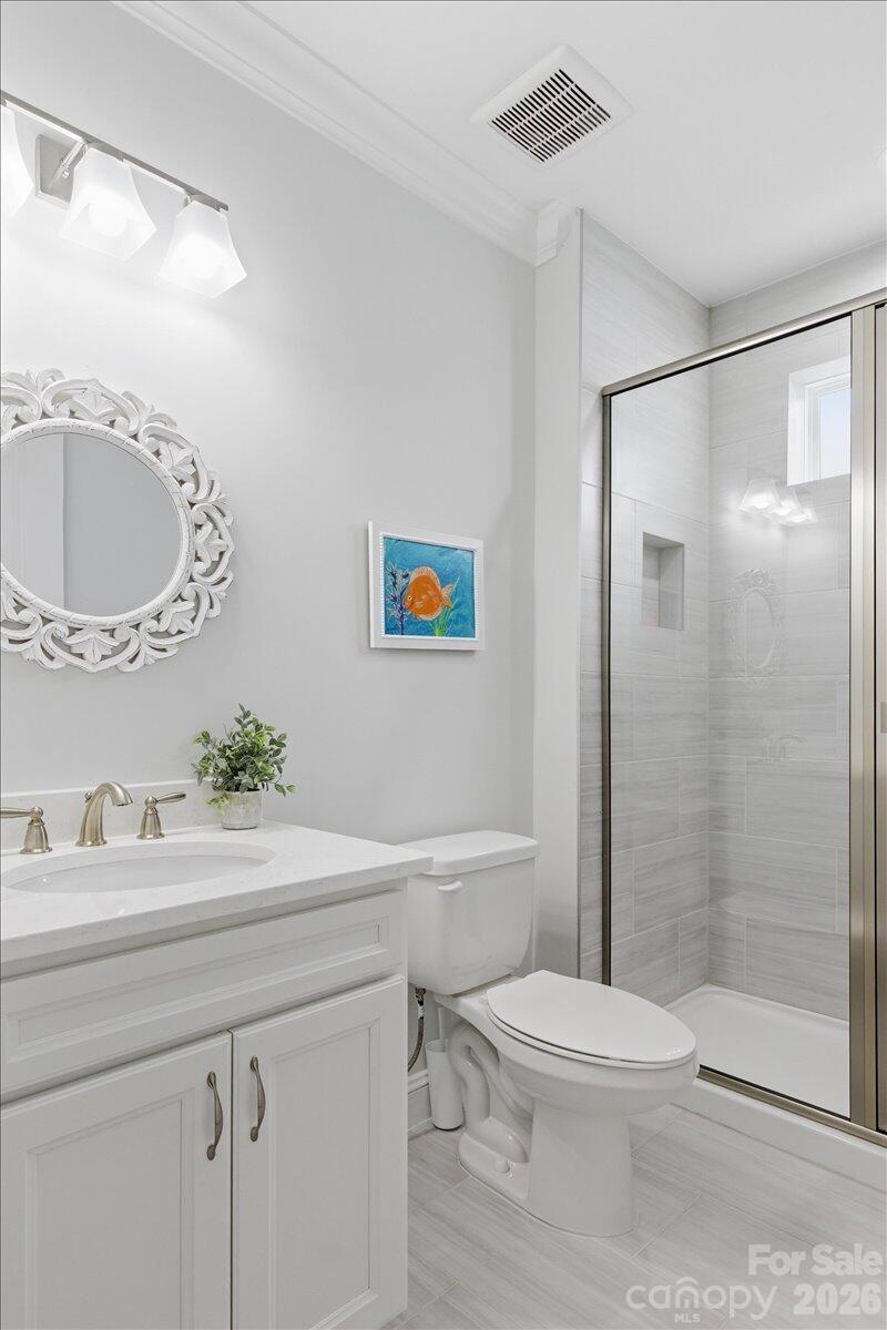 859 Ocean Hammock Loop Hardeeville, SC 29927 - Photo 22 of 33 a bathroom with a sink a toilet and shower