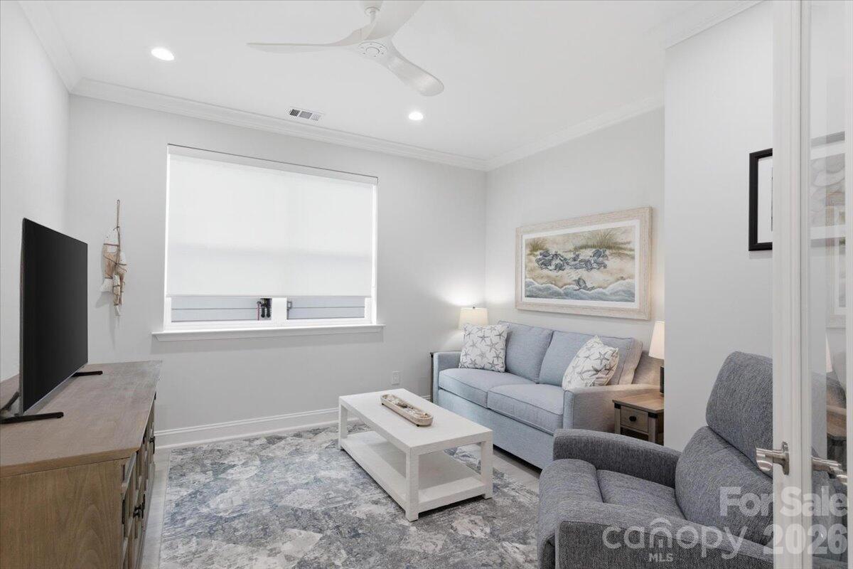 859 Ocean Hammock Loop Hardeeville, SC 29927 - Photo 24 of 33 a living room with furniture and a flat screen tv