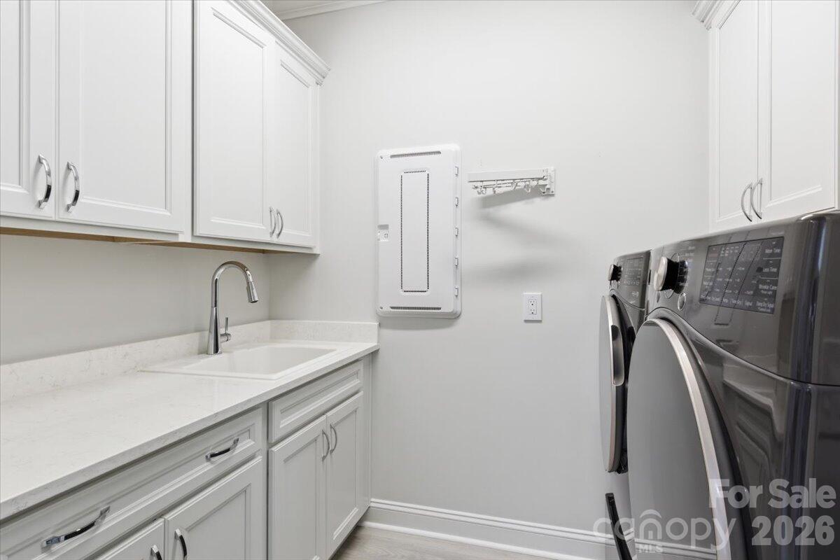 859 Ocean Hammock Loop Hardeeville, SC 29927 - Photo 27 of 33 a bathroom with a sink and a mirror