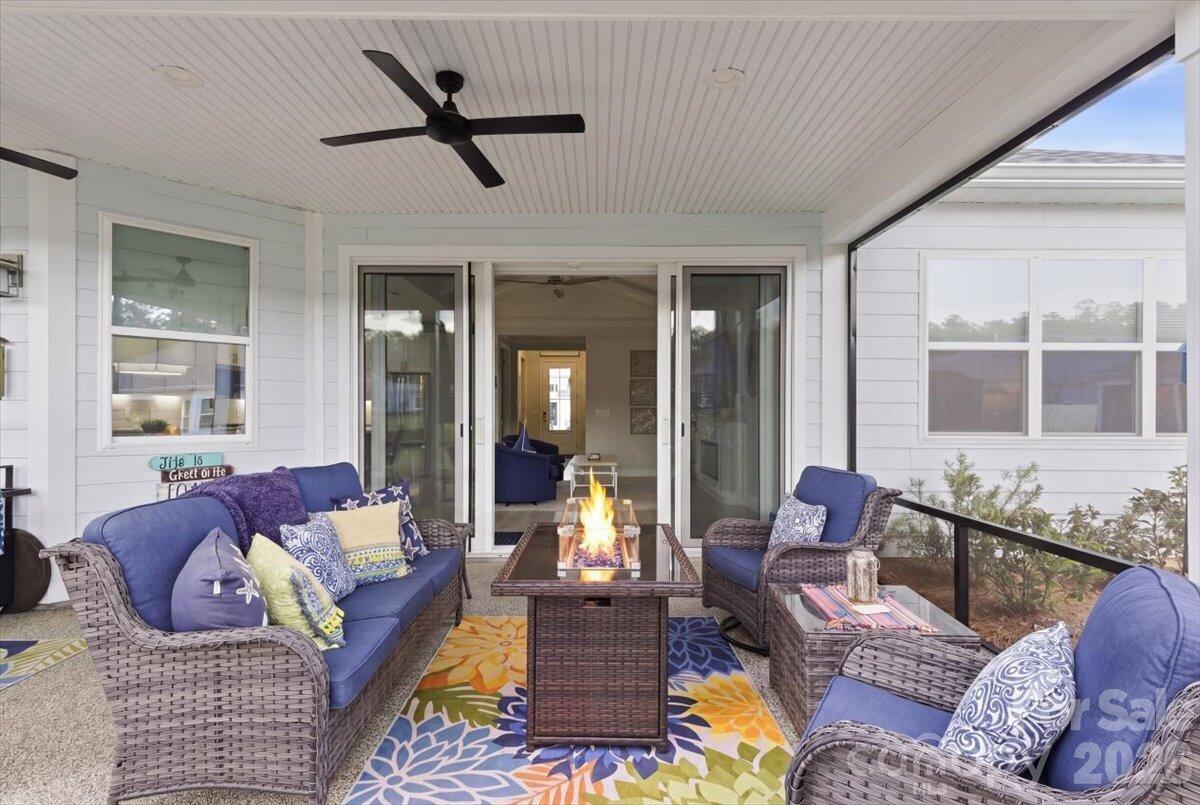 859 Ocean Hammock Loop Hardeeville, SC 29927 - Photo 28 of 33 a living room with furniture and a large window