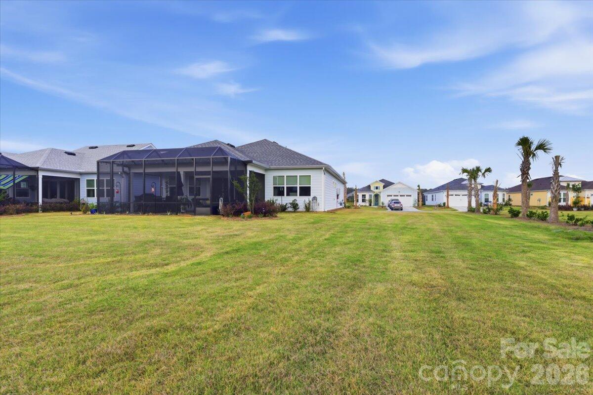 859 Ocean Hammock Loop Hardeeville, SC 29927 - Photo 33 of 33 a front view of house with a garden