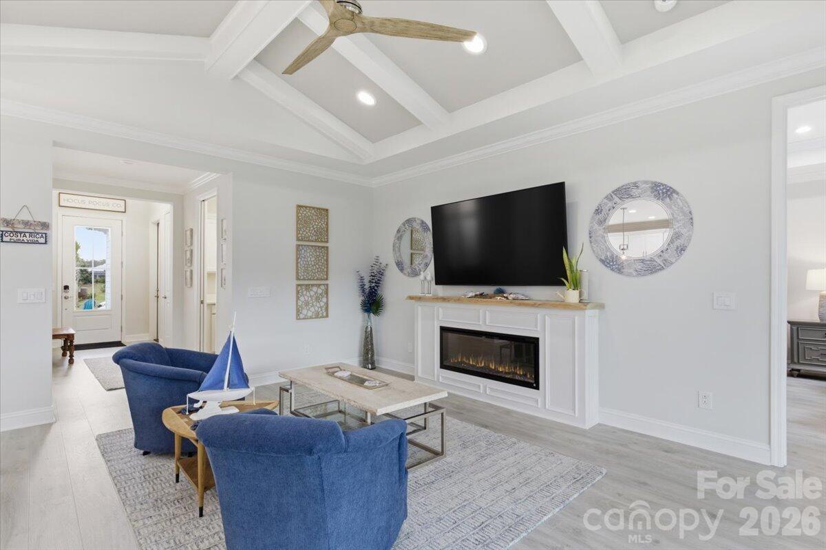 859 Ocean Hammock Loop Hardeeville, SC 29927 - Photo 5 of 33 a living room with furniture a fireplace and a flat screen tv