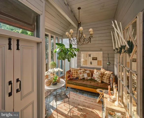 a bedroom with furniture and a potted plant