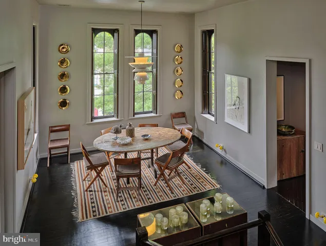 a view of a dining room with furniture and window