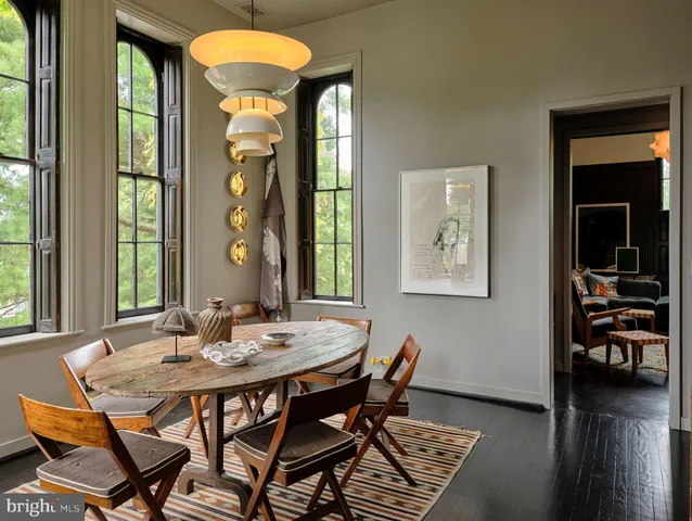 a bedroom with a bed couch and a window