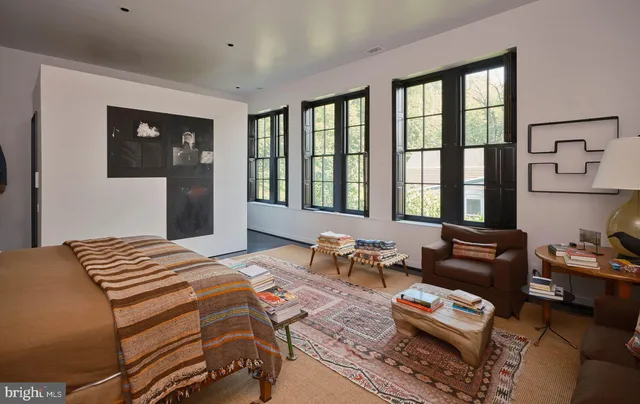 a bedroom with two beds and a window