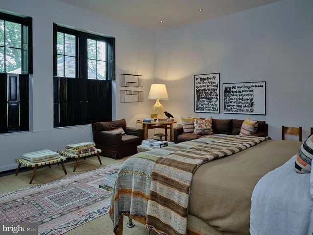 a spacious bathroom with a double vanity sink and a mirror
