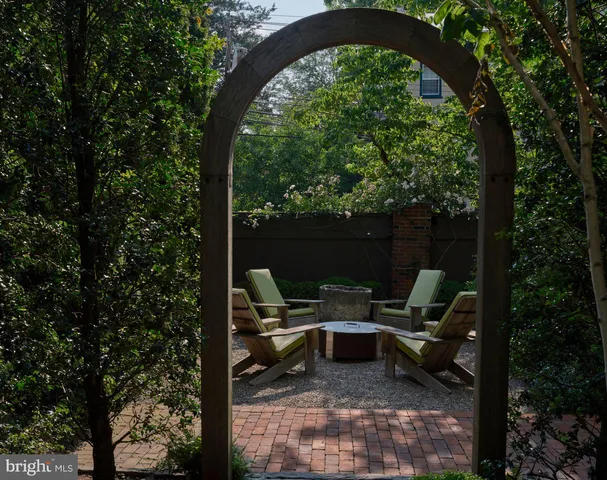 a view of a patio with table and chairs and potted plants