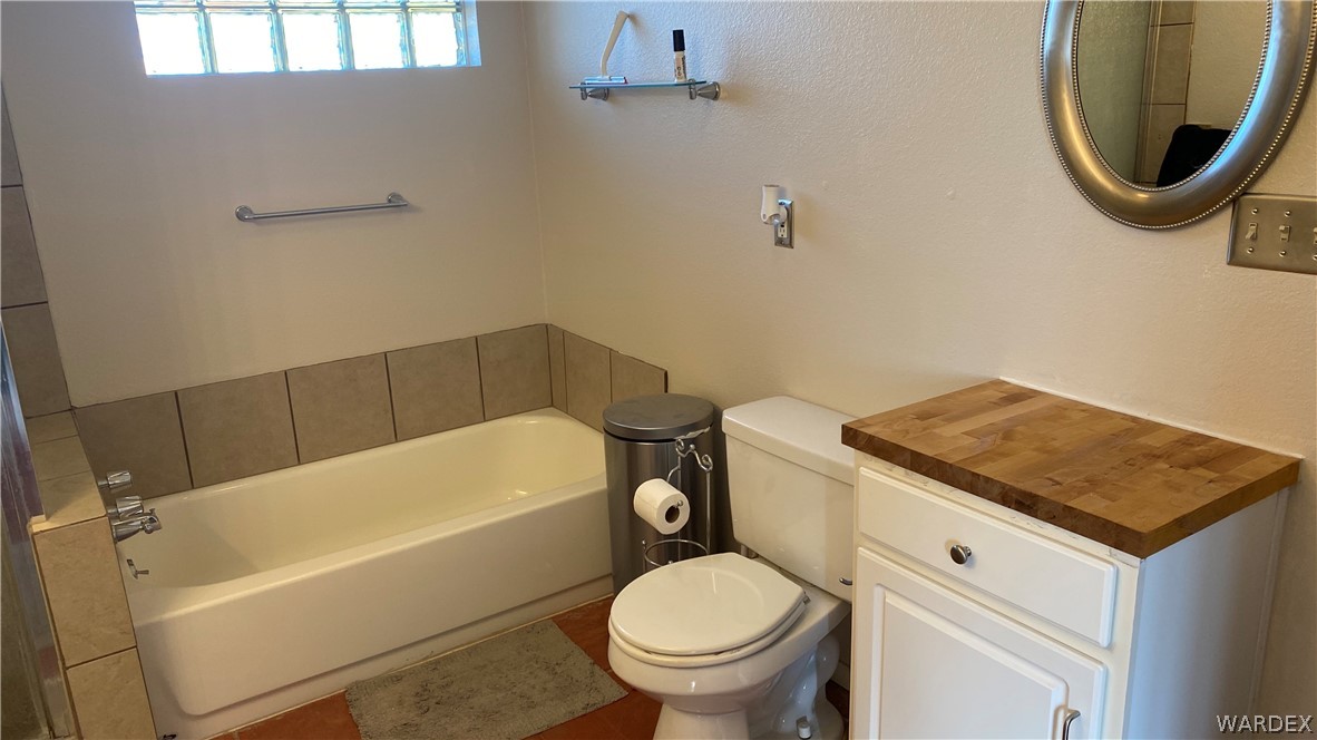 171 South Horn Road Golden Valley, AZ 86413 - Photo 36 of 46 a bathroom with a sink a toilet and bathtub