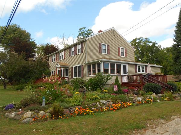 51 Main Road Westhampton, MA 01027 - Photo 1 of 29 a front view of a house with a garden and plants