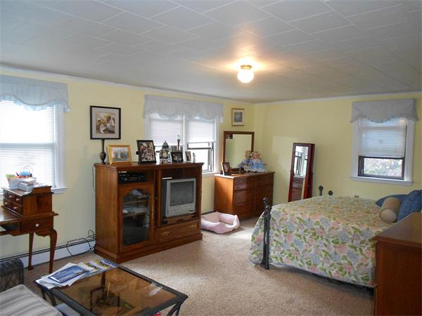51 Main Road Westhampton, MA 01027 - Photo 17 of 29 a living room with furniture a flat screen tv and dresser