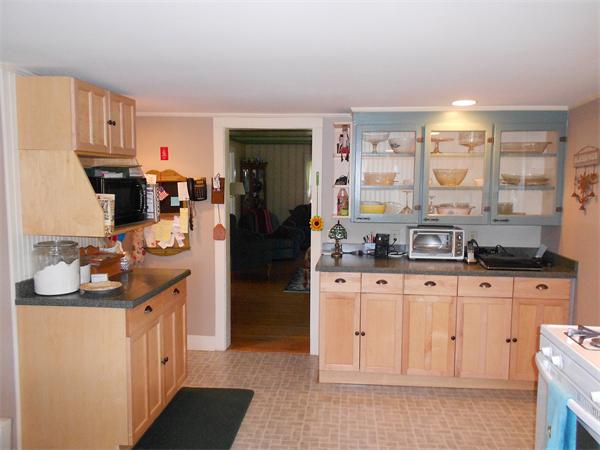 51 Main Road Westhampton, MA 01027 - Photo 4 of 29 a kitchen with granite countertop a sink and cabinets