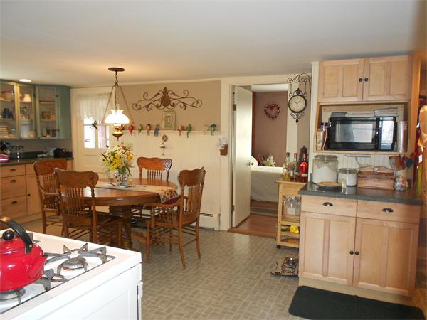 51 Main Road Westhampton, MA 01027 - Photo 6 of 29 a kitchen with cabinets and chairs