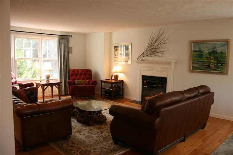 150 Blue Heron Road Wellfleet, MA 02667 - Photo 15 of 35 a living room with furniture and a fireplace