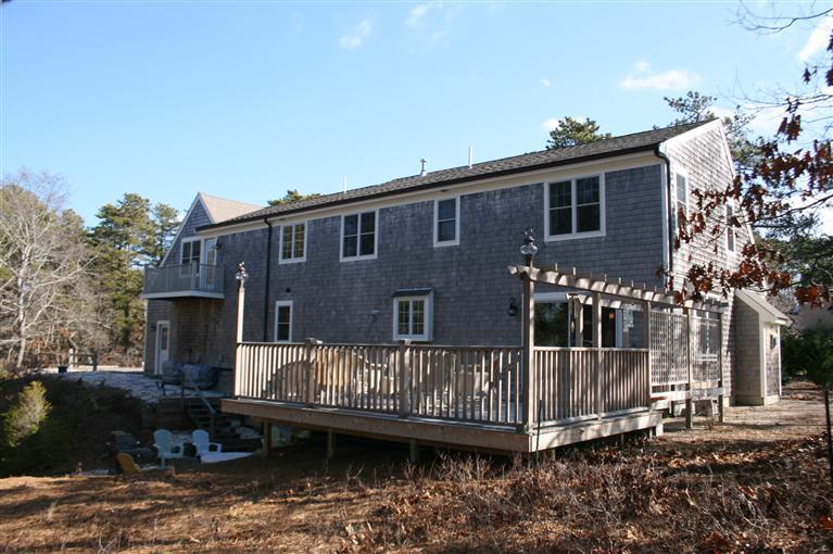 150 Blue Heron Road Wellfleet, MA 02667 - Photo 3 of 35 a view of a house with a deck