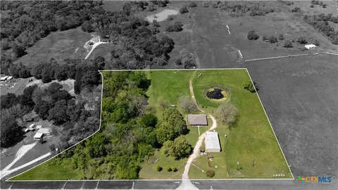 an aerial view of garden with swimming pool