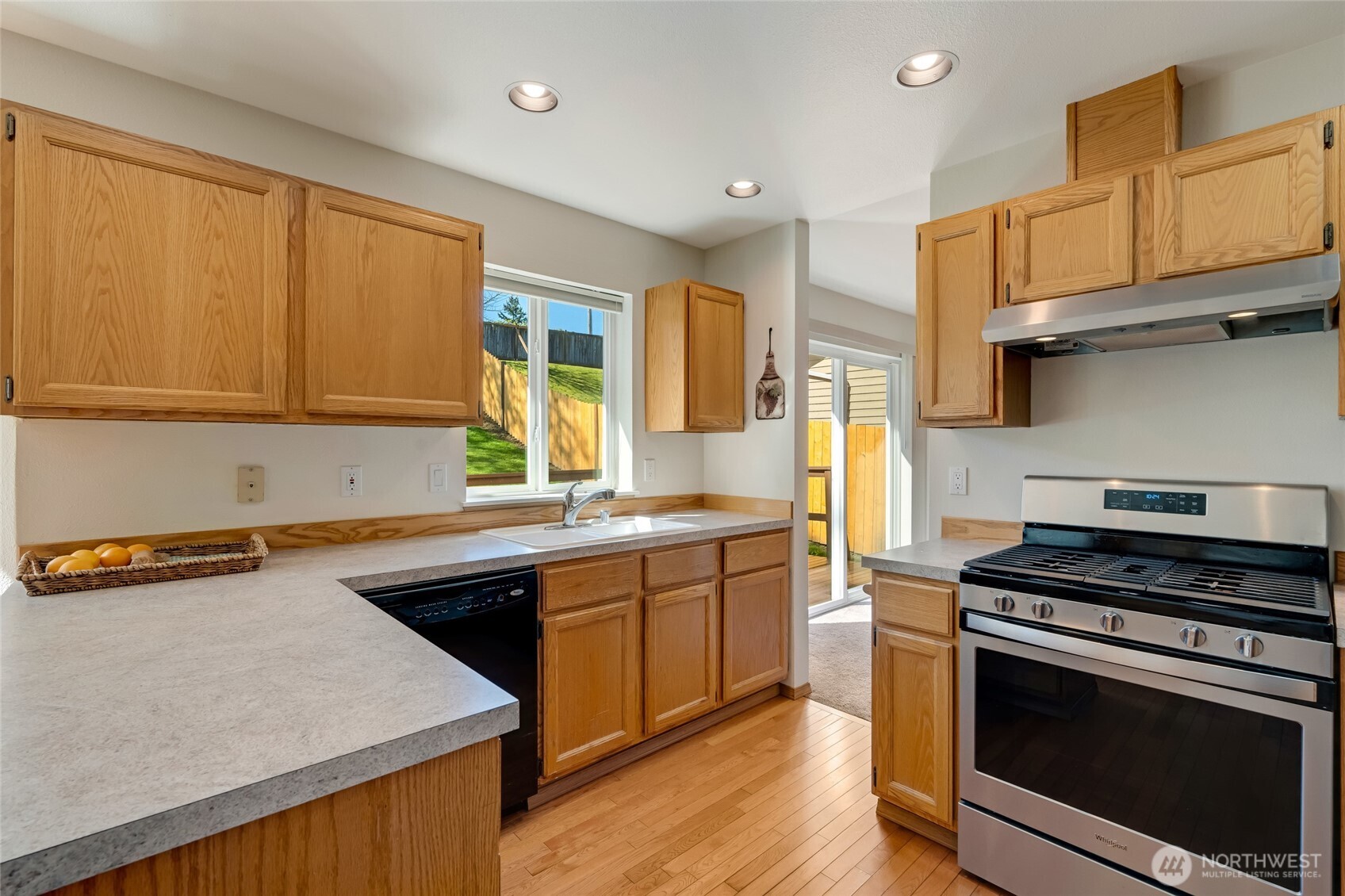 14 60th Place Southeast Everett, WA 98203 - Photo 11 of 35 a kitchen with stainless steel appliances a stove a sink and cabinets