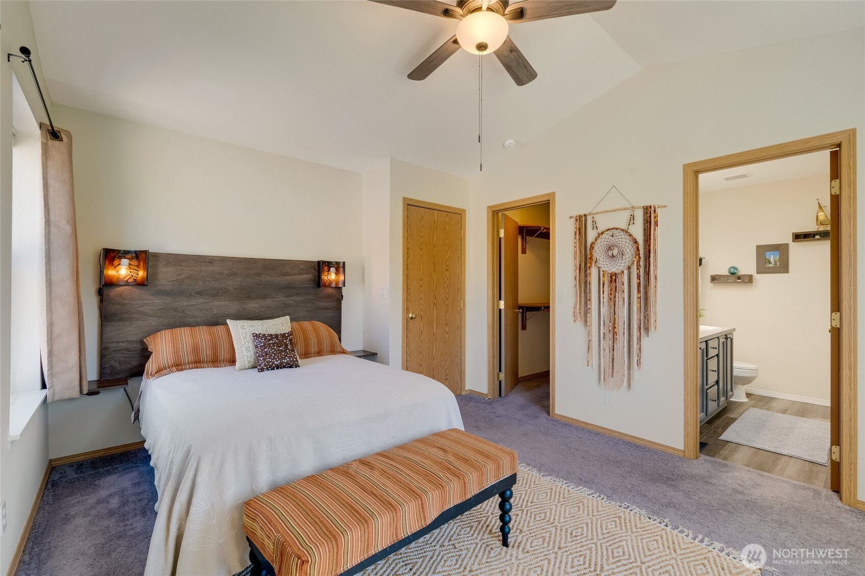 14 60th Place Southeast Everett, WA 98203 - Photo 18 of 35 a bedroom with a bed and a chandelier