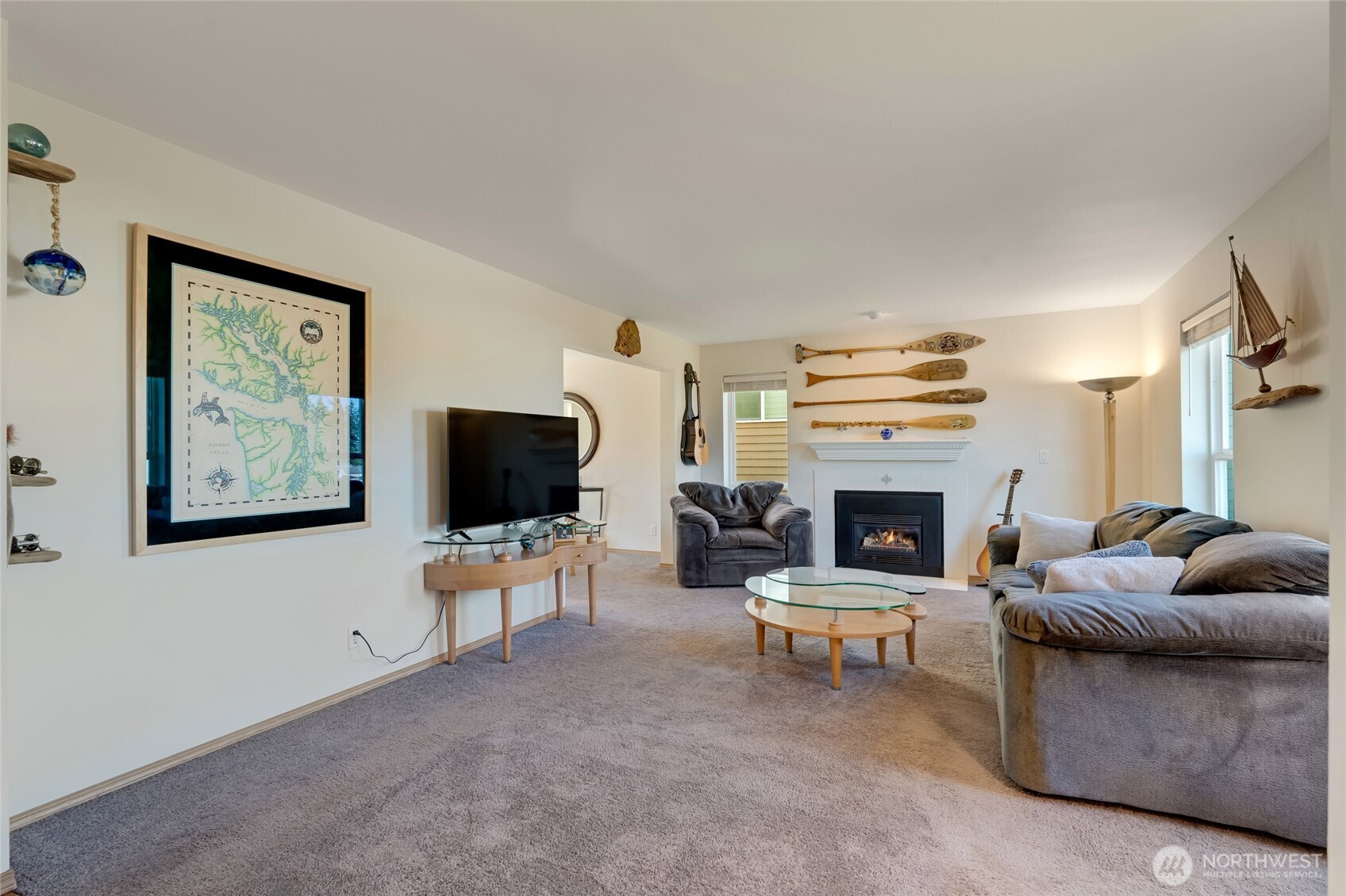 14 60th Place Southeast Everett, WA 98203 - Photo 5 of 35 a living room with furniture a fireplace and a flat screen tv