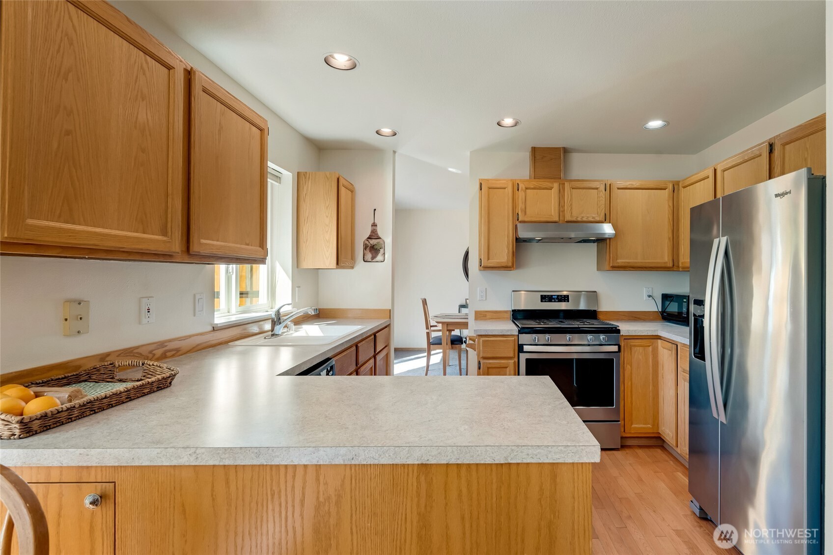 14 60th Place Southeast Everett, WA 98203 - Photo 9 of 35 a kitchen with stainless steel appliances granite countertop a sink stove and refrigerator