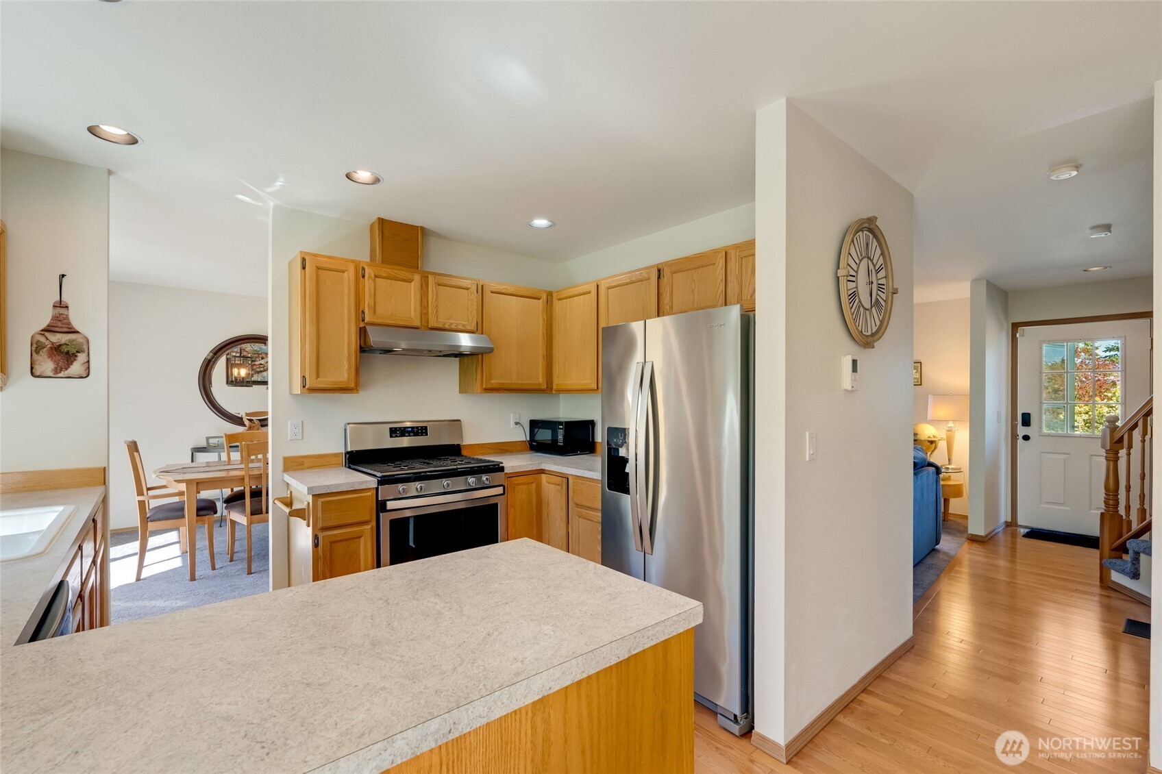 14 60th Place Southeast Everett, WA 98203 - Photo 10 of 35 a kitchen with stainless steel appliances granite countertop a refrigerator a stove top oven a sink and dishwasher