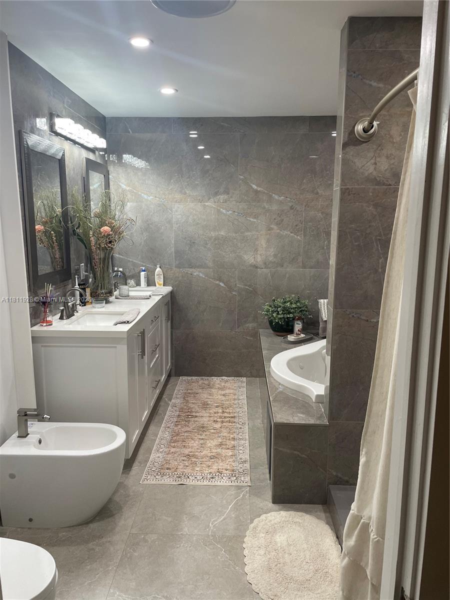 19700 Southwest 184th Street Miami, FL 33187 - Photo 18 of 52 a bathroom with a sink toilet and shower