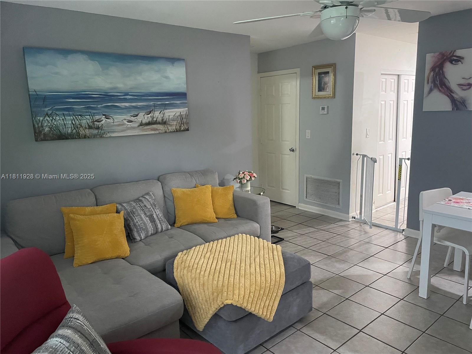 19700 Southwest 184th Street Miami, FL 33187 - Photo 24 of 52 a living room with furniture and a rug