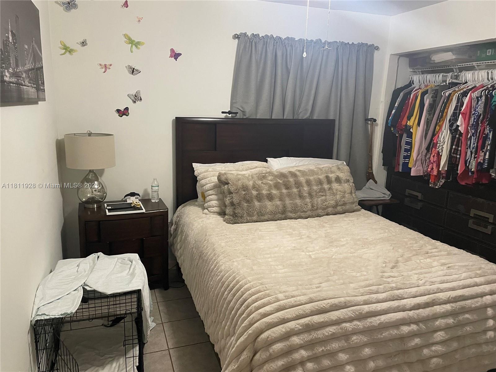 19700 Southwest 184th Street Miami, FL 33187 - Photo 26 of 52 a bedroom with a bed and a lamp with the dresser