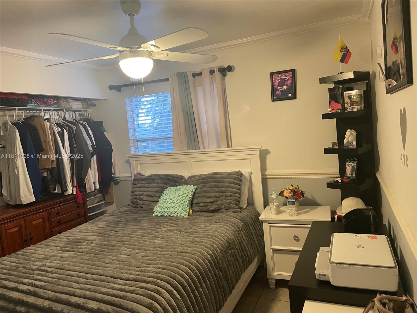 19700 Southwest 184th Street Miami, FL 33187 - Photo 27 of 52 a bedroom with a bed and furniture