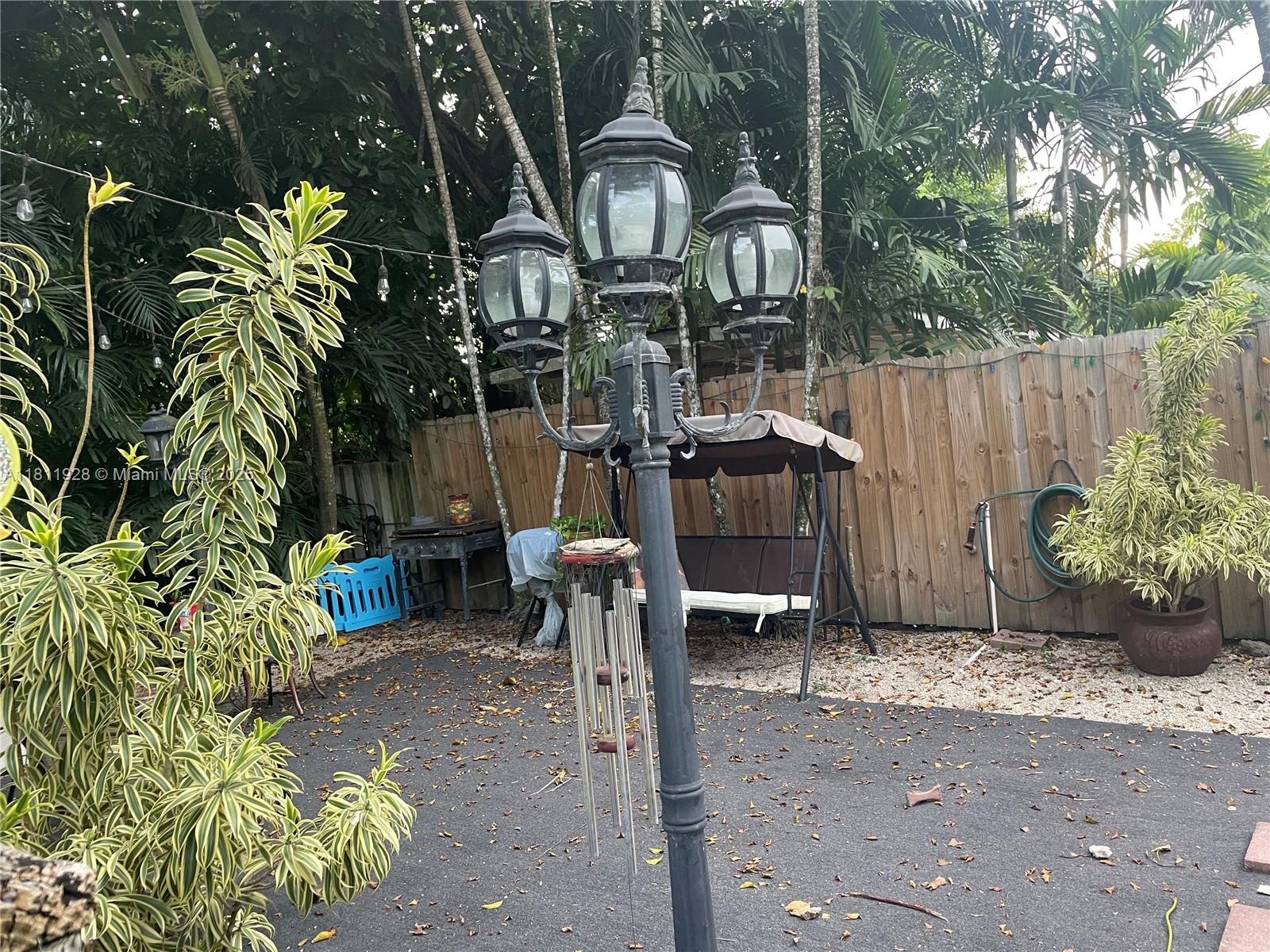 19700 Southwest 184th Street Miami, FL 33187 - Photo 31 of 52 a front view of a house with a yard