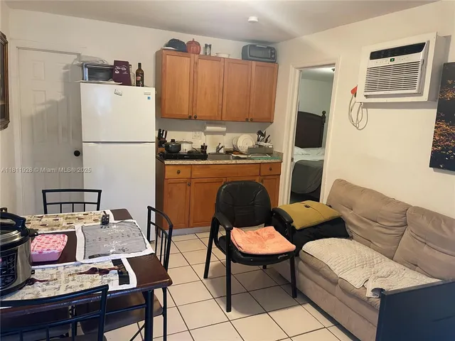 a bedroom with a bed and a mirror