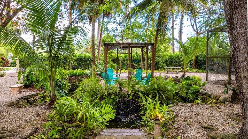 19700 Southwest 184th Street Miami, FL 33187 - Photo 40 of 52 a view of outdoor space with garden