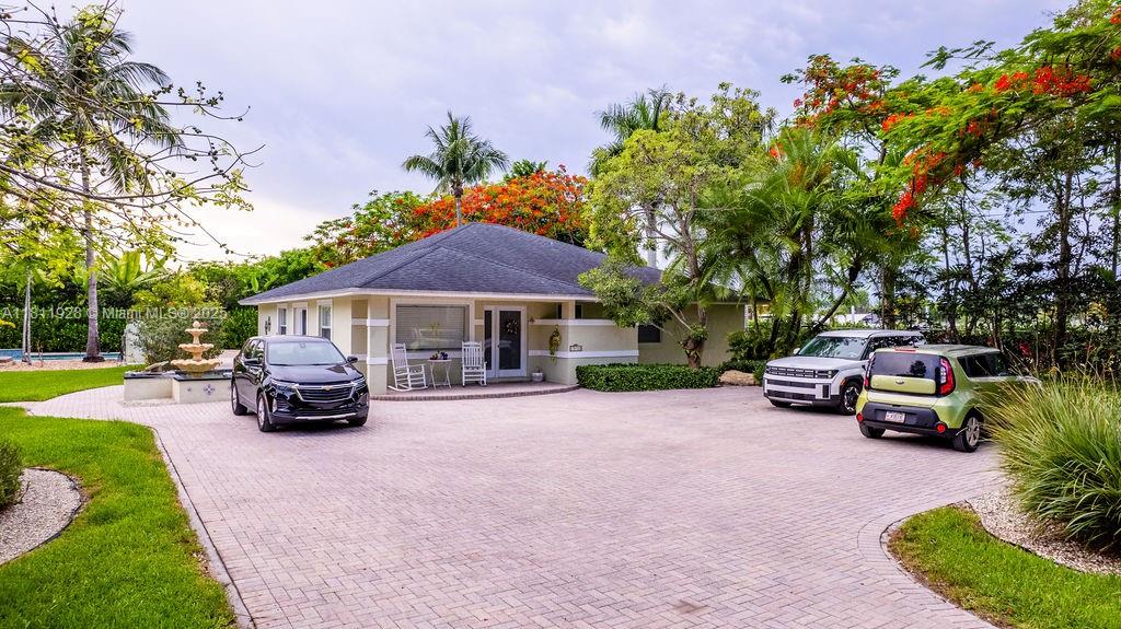 19700 Southwest 184th Street Miami, FL 33187 - Photo 6 of 52 a view of a house with sitting area and garden