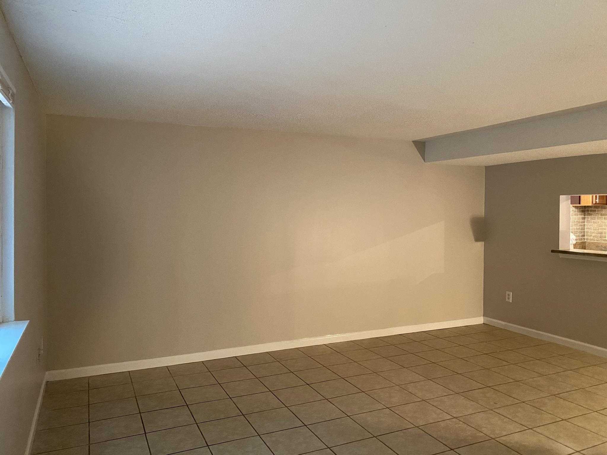 7717 Bernadette Lane Raleigh, NC 27615 - Photo 11 of 26 a view of an empty room and window