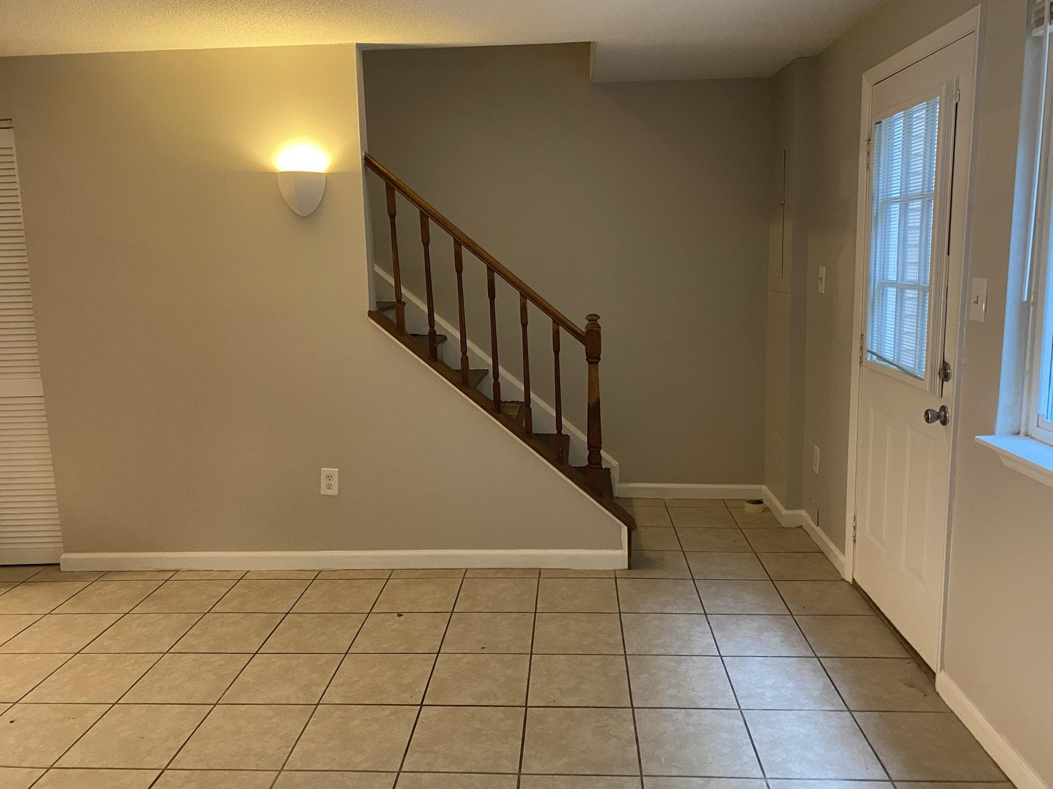 7717 Bernadette Lane Raleigh, NC 27615 - Photo 16 of 26 a view of entryway with stairs