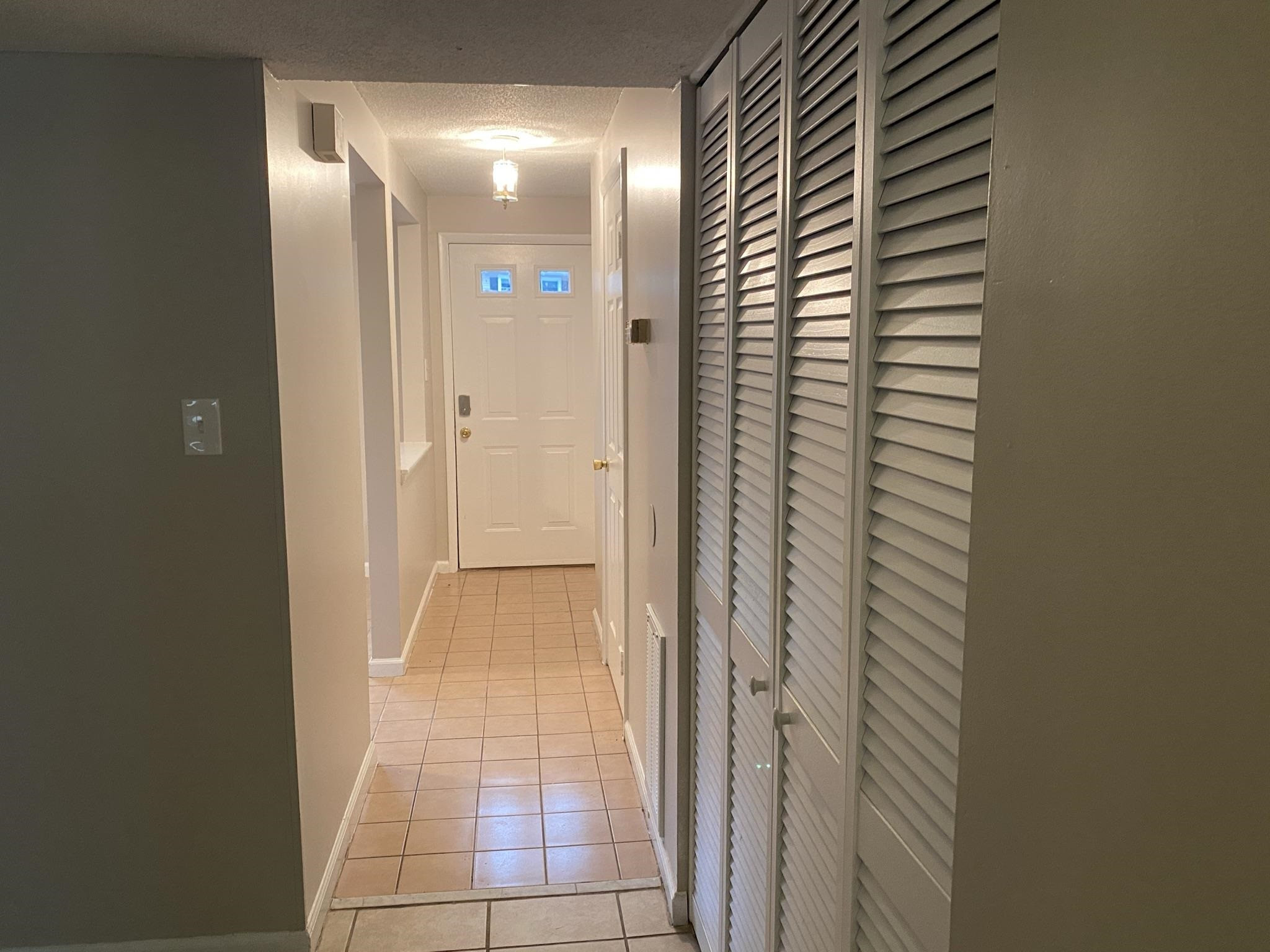 7717 Bernadette Lane Raleigh, NC 27615 - Photo 2 of 26 a view of a bathroom from a hallway