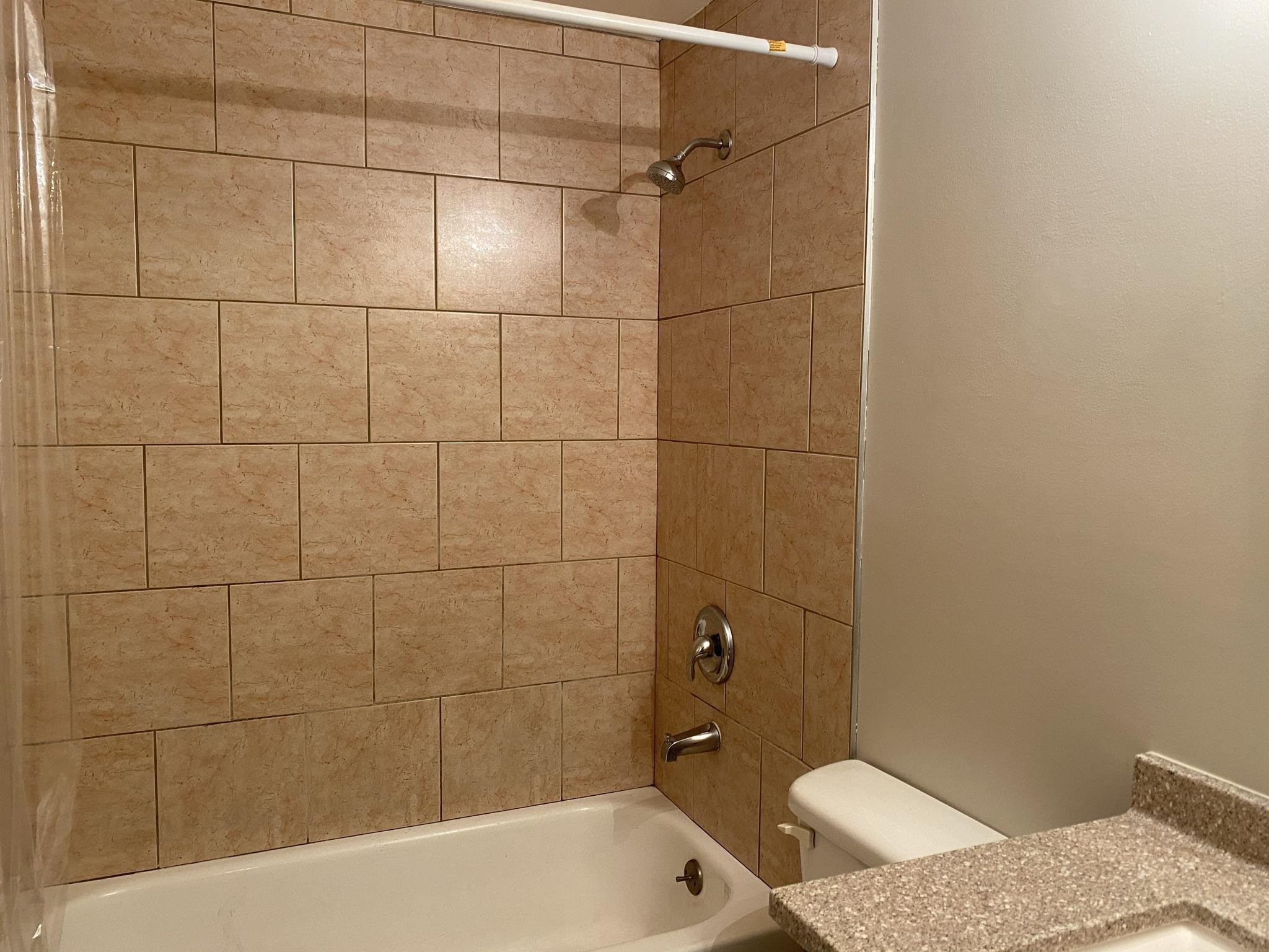7717 Bernadette Lane Raleigh, NC 27615 - Photo 23 of 26 a bathroom with a sink and toilet