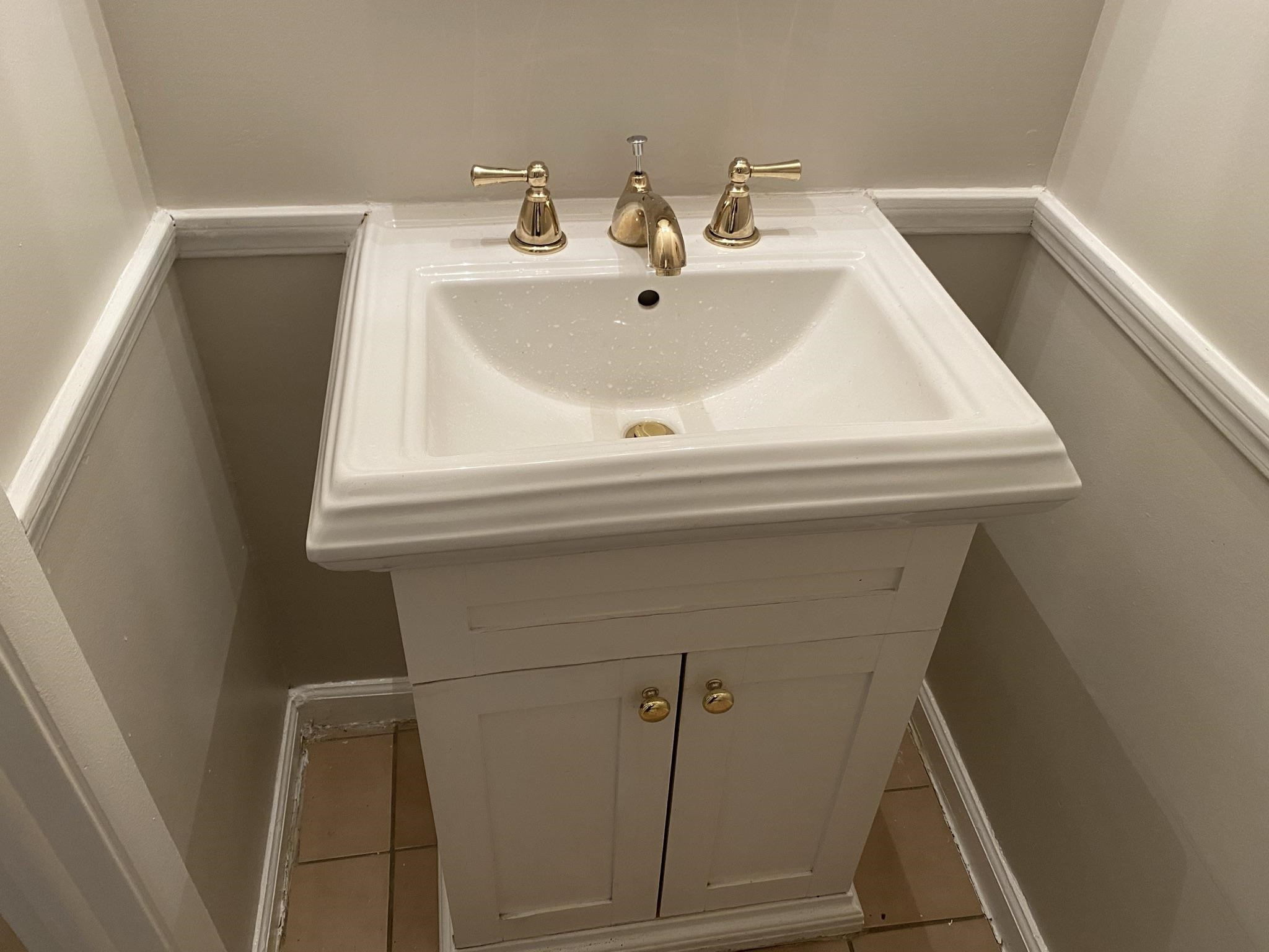 7717 Bernadette Lane Raleigh, NC 27615 - Photo 3 of 26 a bathroom with a sink and mirror
