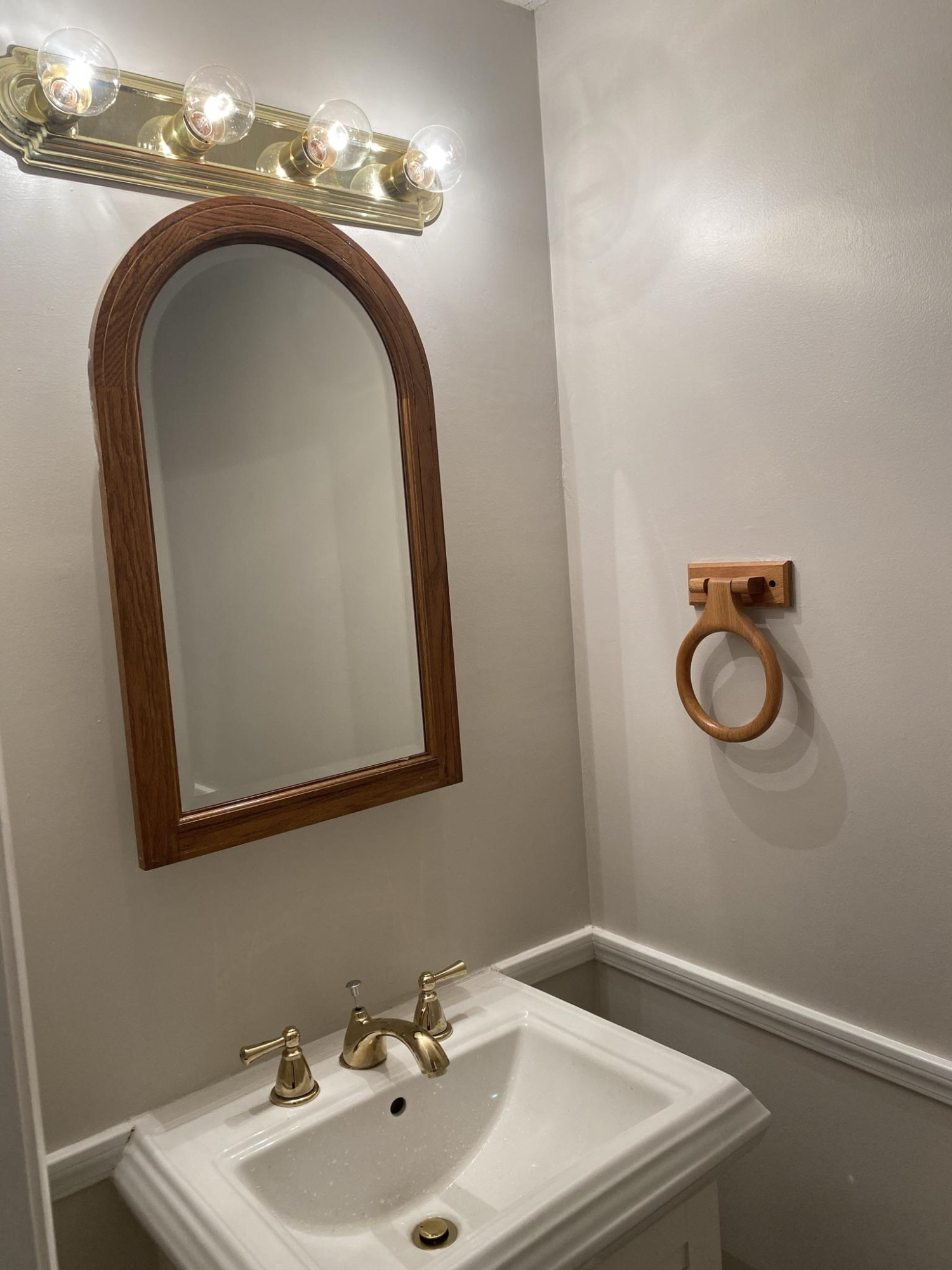 7717 Bernadette Lane Raleigh, NC 27615 - Photo 4 of 26 a bathroom with a sink and a mirror